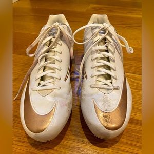 NIKE VPR lacrosse cleats, rose gold and white. Lightly worn.
